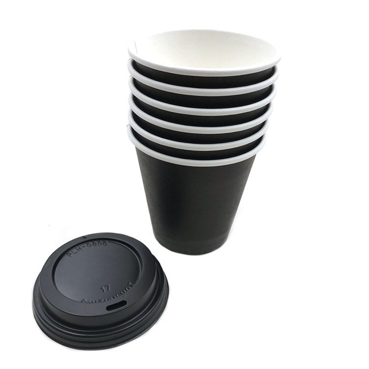 Stack of black eight oz paper cups with matching black lids placed in front