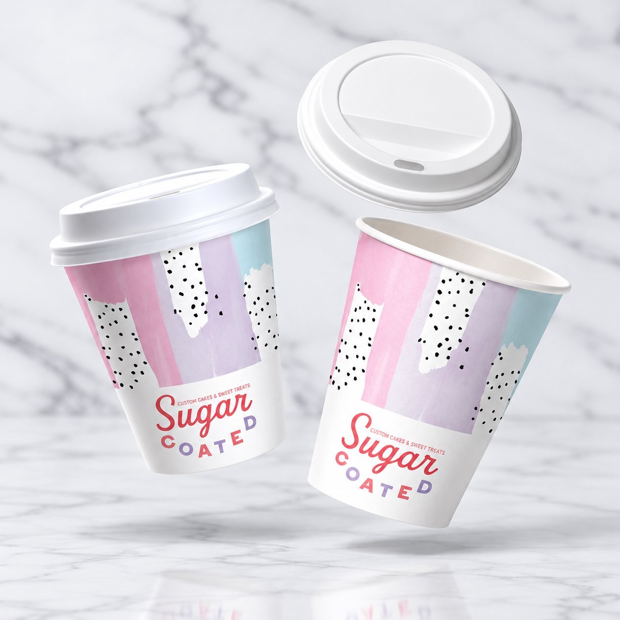Two matching paper cups — one with a sip lid seated, one with the lid floating above the rim showing the fit interface.