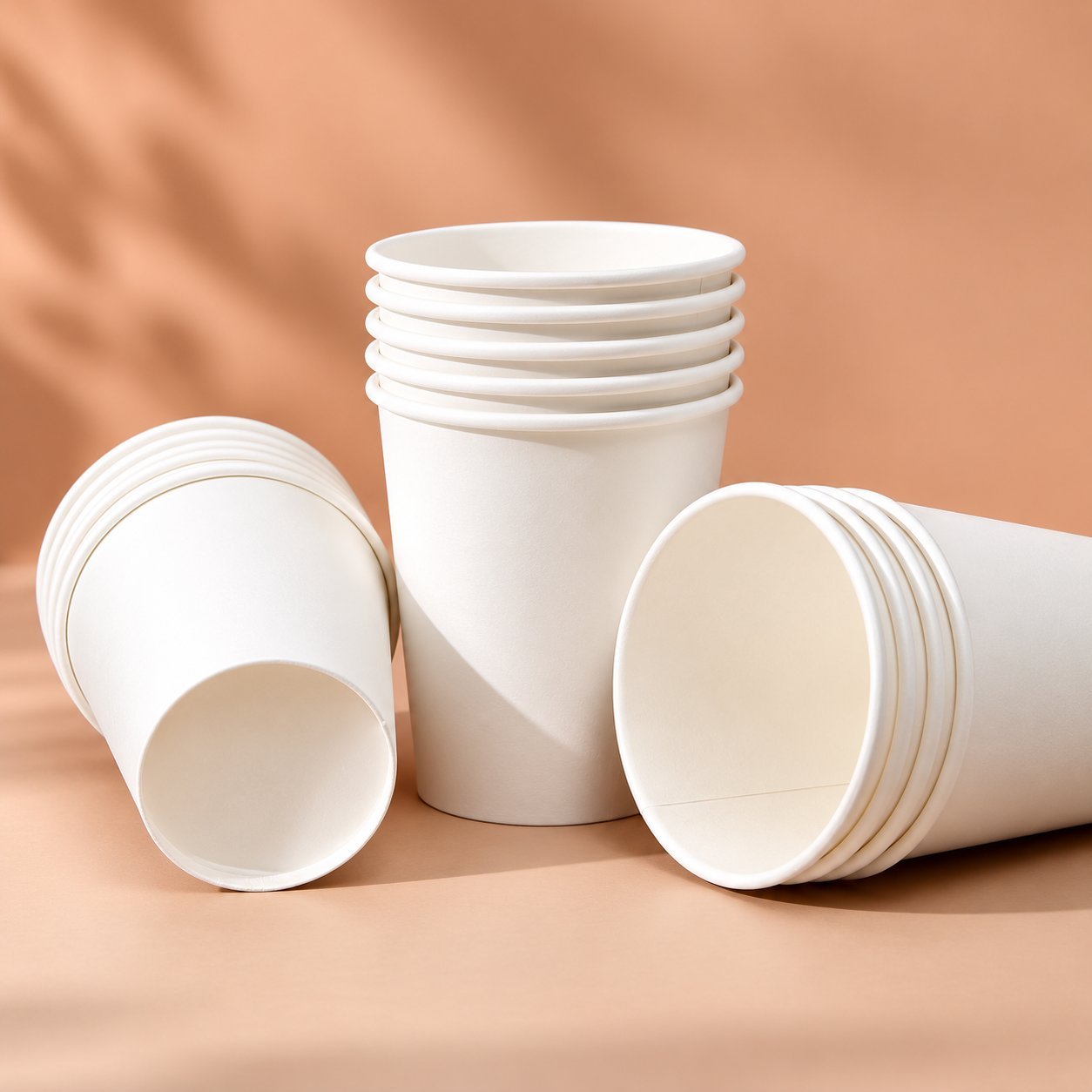 Plain white paper cups showing the formed cup body and rim without printing or lids.