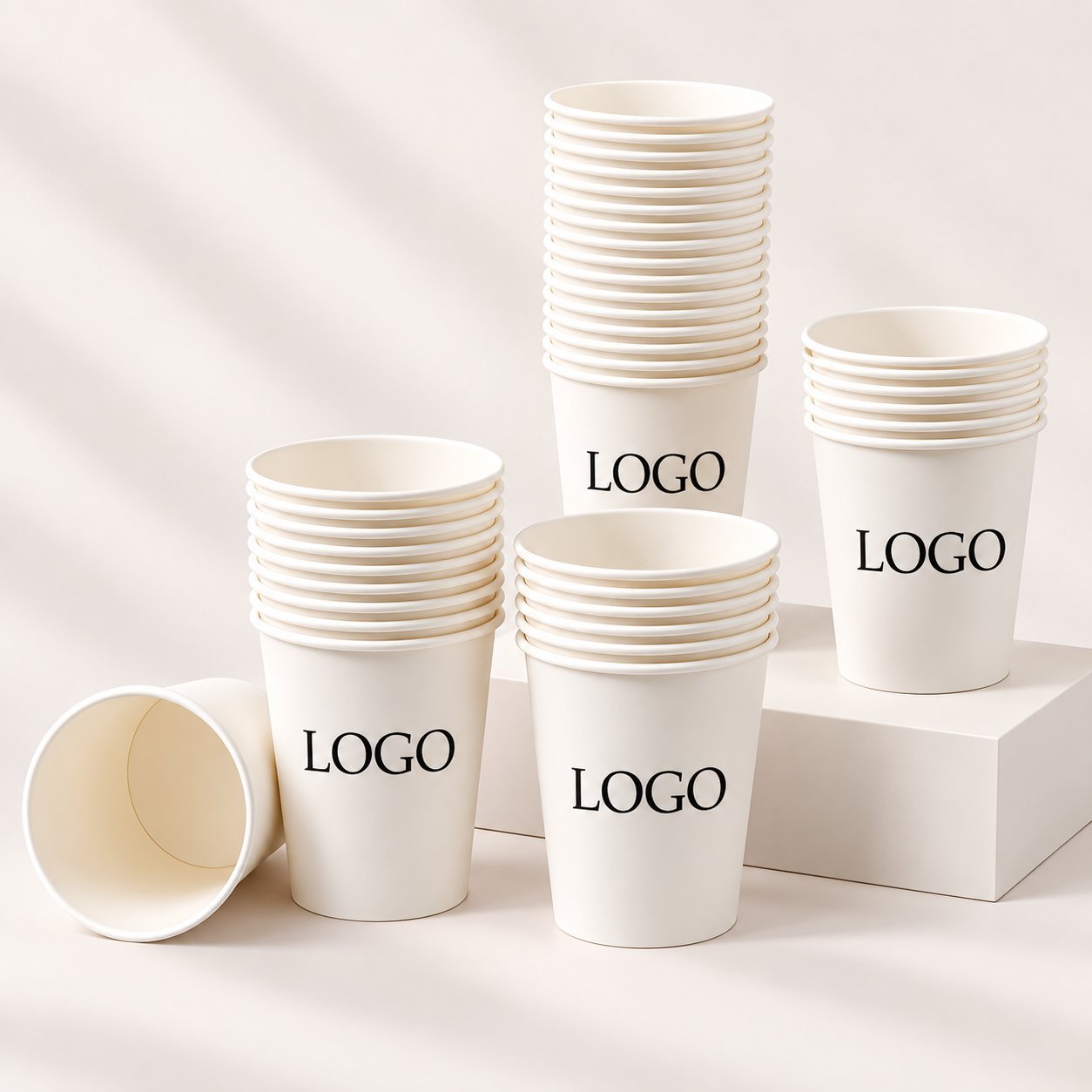 Plain white paper cup mockups with logo placeholders in multiple sizes, showing SKU variety.