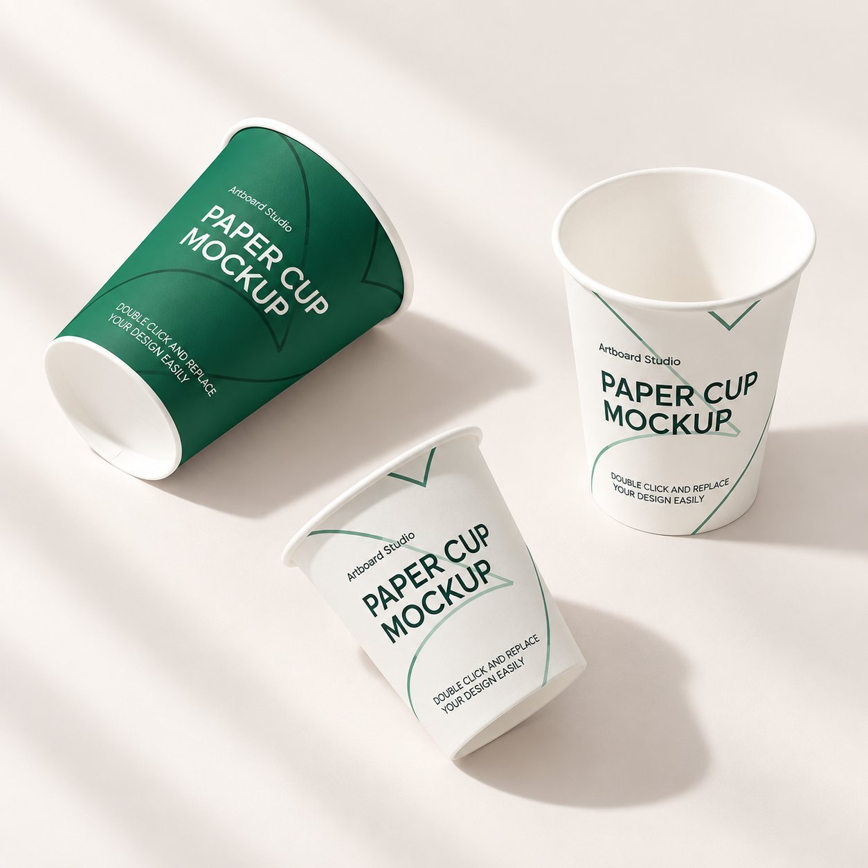Three paper cups showing multi-color printed designs with line illustrations and typography.