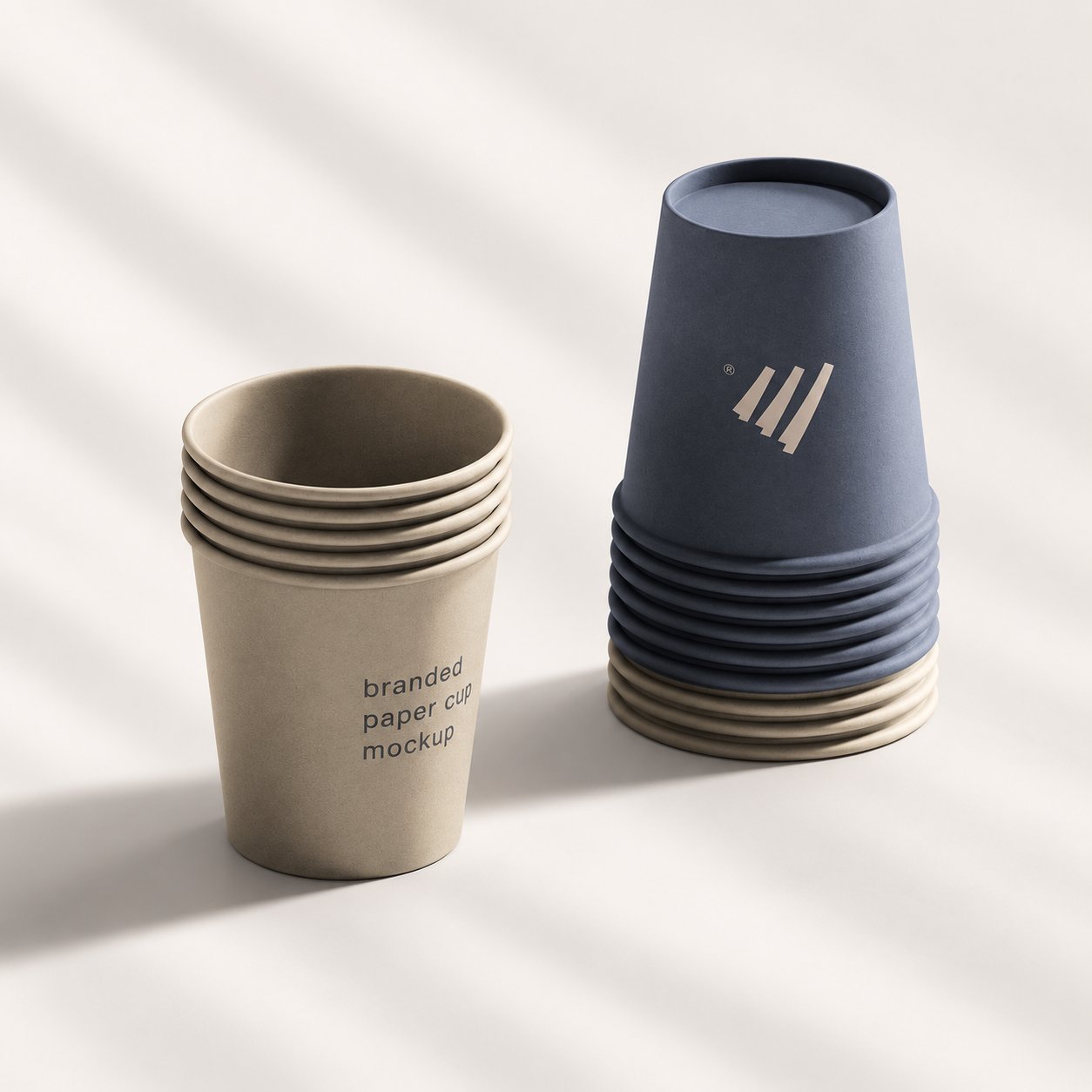 Kraft and navy paper cups with minimalist single-color logo prints in two different finishes.