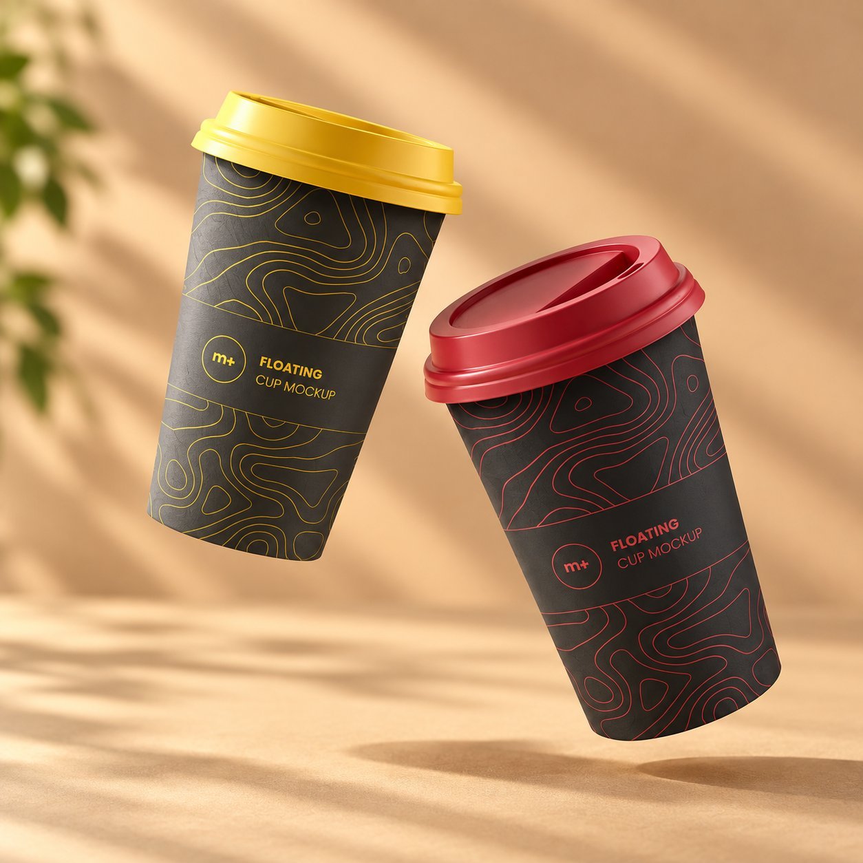 Two black paper cups with topographic-line graphics, one with a yellow lid and one with a red lid, suspended in mid-air — a printed PE- or water-based coated finish that holds its color under normal hot-beverage service.
