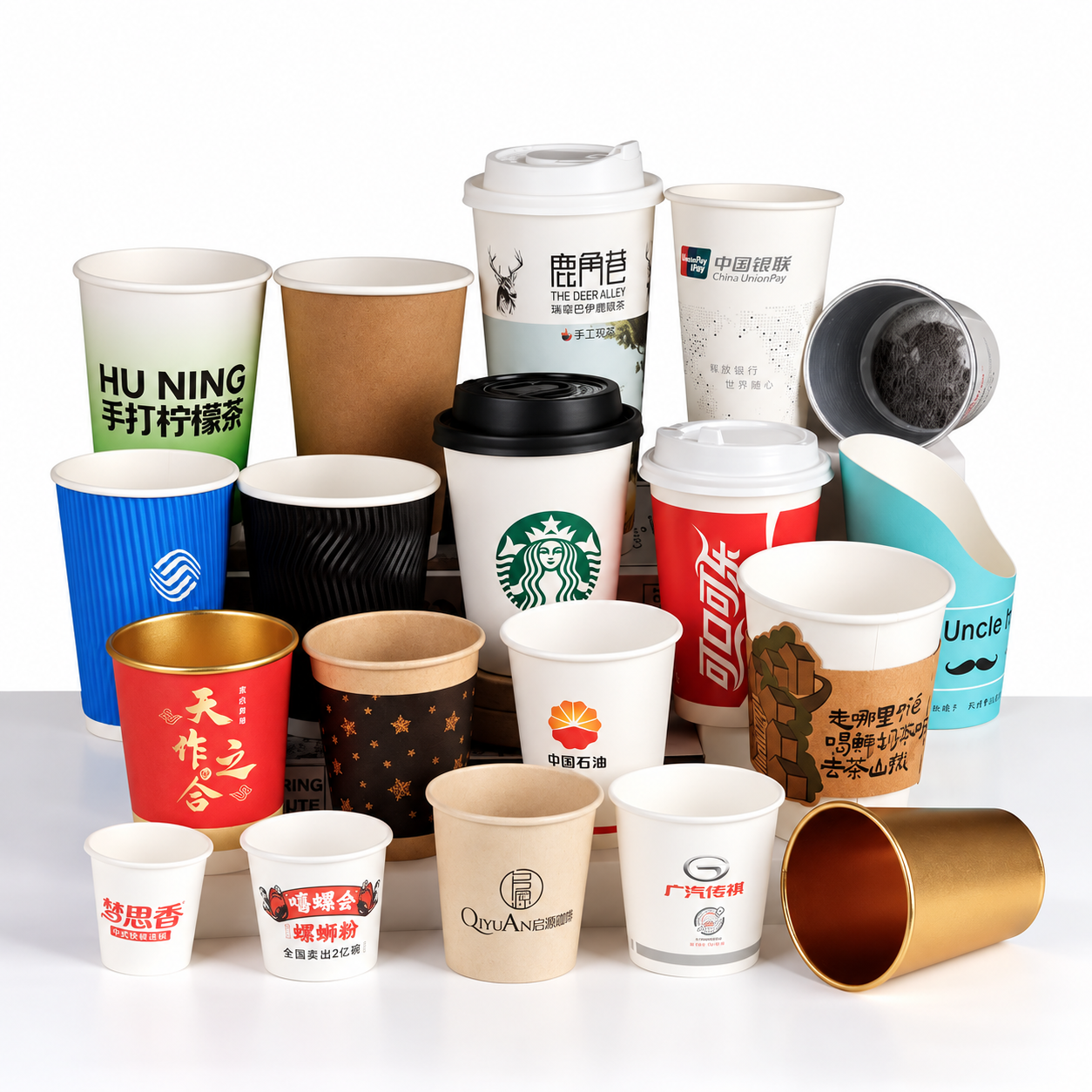 Mixed paper cup supplier samples in different sizes, colors and constructions arranged for comparison