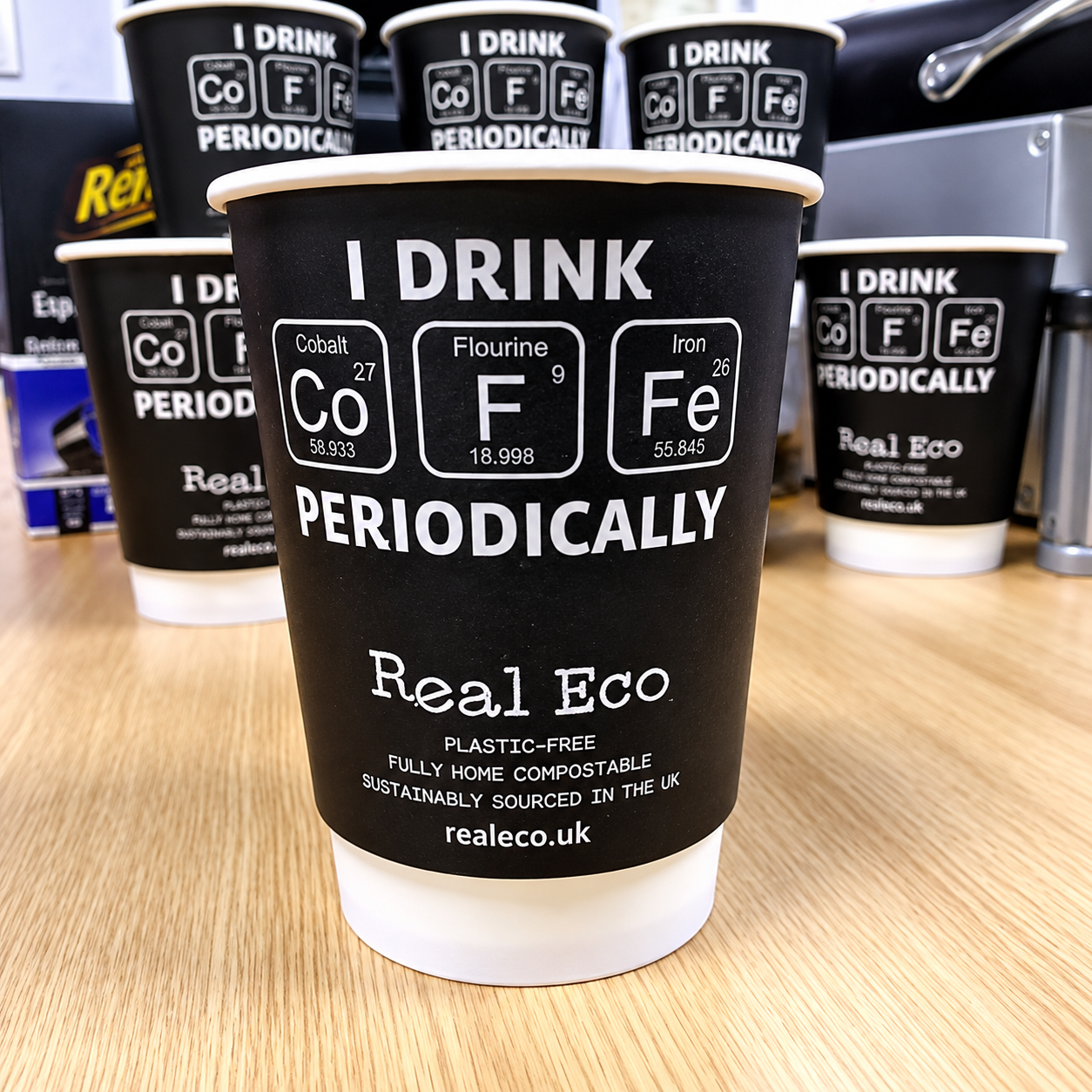 Black printed paper cups with plastic free and home compostable claim wording