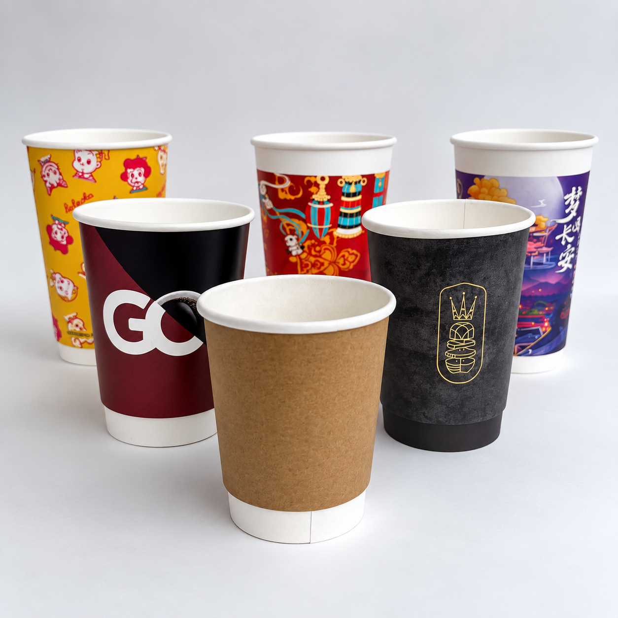 Assorted printed paper cups for wall construction and container volume comparison