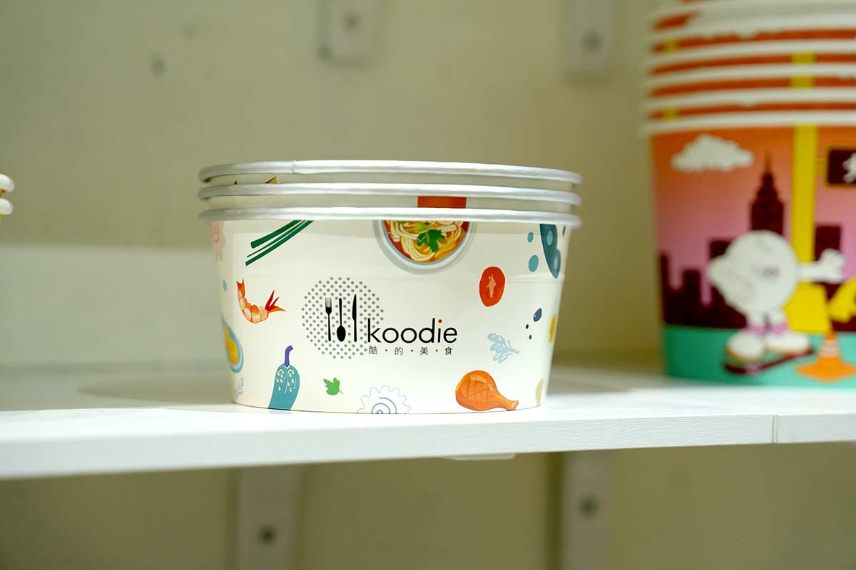 white illustrated paper food bowl