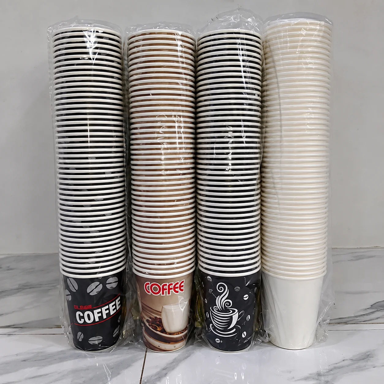 Wrapped stacks of printed and plain paper cups for packaging specification