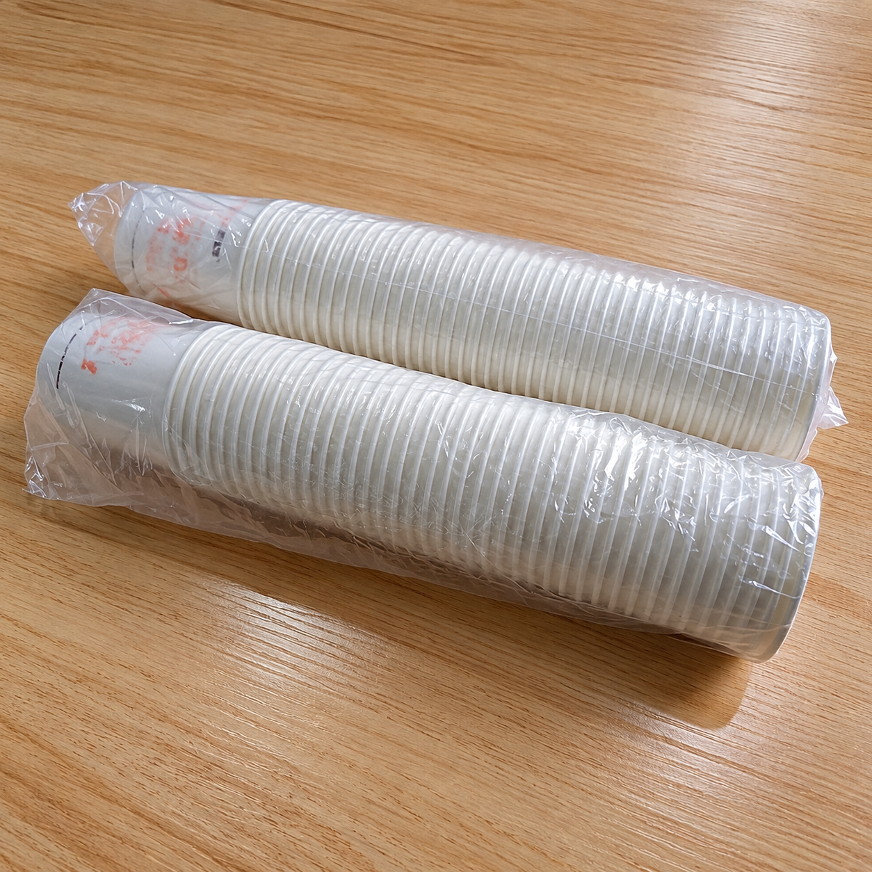 Wrapped paper cup stacks showing packed cup volume for shipment planning