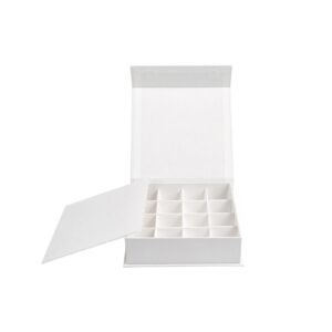 Book style chocolate box open showing white compartment dividers
