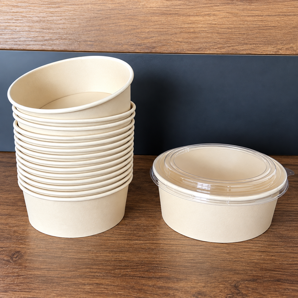 Stacked paper bowls and one paper bowl with clear lid